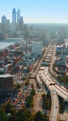 Wall Mural - Urban scenery of American city at daytime. Beautiful Philadelphia downtown from drone footage. Vertical video