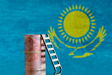 Wall Mural - 5000 Kazakh tenge banknote against the background of the flag of the Republic of Kazakhstan.