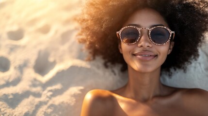 Wall Mural - Joyful African woman with afro in sunglasses at beach. Ideal for summer lifestyle, natural beauty, or carefree vacation content.