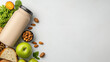 © javu - Healthy smoothie with fruits, nuts, and bread on light background