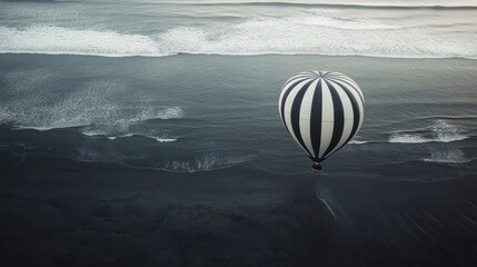 Wall Mural - Hot air balloon over ocean beach, waves crashing