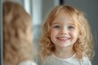 © Solid Tech - Happy lovely little European girl looking in mirror at her teeth after teeth polishing procedure in pediatric stomatology, Generative AI