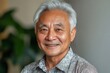 © Ravi - Portrait smile handsome senior mature Asian man isolated background