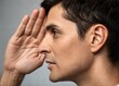 © Aminograpix - Close-up profile of a man intently listening.