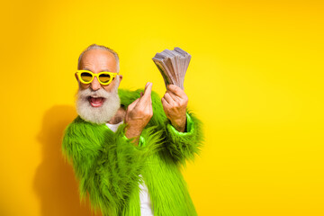 Canvas Print - Eccentric mature man celebrating with cash in a colorful fashion