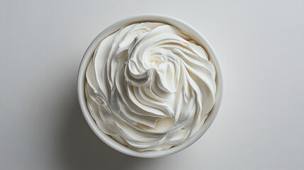 Wall Mural - Whipped cream in a white bowl bundle, isolated on a white background.