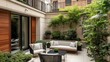 © RaksaLinggo - Tranquil courtyard featuring furniture and plants within a modern building