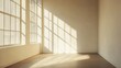 © RaksaLinggo - Sunlight streams through large windows illuminating an empty room