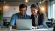 © Ada - Mature Latin business man and European business woman discussing project on laptop gadget in office. Two diverse partners, colleagues, team of confident professional business people work together