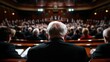 © JoxyAimages - A distinguished audience is seen from behind in a formal assembly room, creating a powerful image of unity and collective engagement in discussions that shape society.