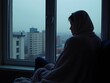© Ali - A person sitting by a window, looking out at a rainy cityscape, deep in thought, wrapped in a cozy blanket, symbolizing loneliness, depression, sadness, and the need for emotional healing and support