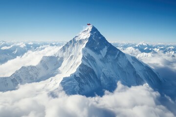 majestic peak of a snow-covered mountain standing tall above the clouds on a clear day at high altit