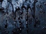 Oil spill drips on dark ground; environmental disaster