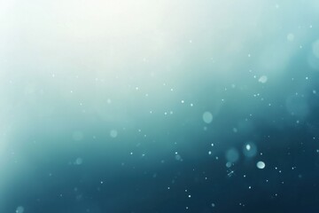 Wall Mural - soft blue bokeh background with gentle light and floating particles