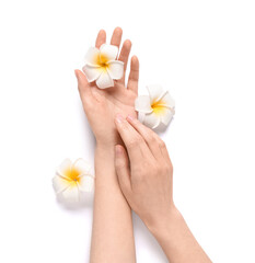 Wall Mural - Beautiful female hands with plumeria flowers on grey background