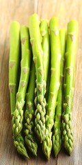 Canvas Print - Asparagus spears displayed on wood; close-up for healthy eating or seasonal recipe ideas