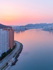 Wall Mural - Cityscape at sunrise. Coastal road by buildings, mountains beyond the river. Use Tourism promotion