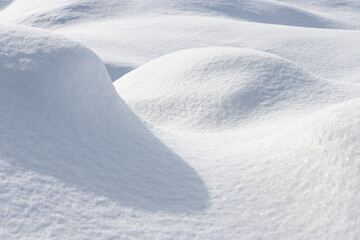 Wall Mural - abstract background of mounds of fresh white snow with light and shadow
