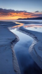 Canvas Print - Seaside stream flows to ocean at sunset; dramatic clouds reflect on water. Backdrop for travel, blog, nature sites