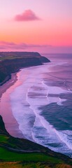 Canvas Print - Waves crashing on shore at coast as colorful sunset dyes sky behind cliffs