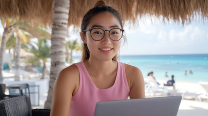 Korean woman in sleeveless t-shirt working with laptop at beach tropical seaside