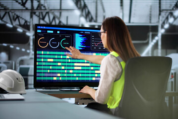 Poster - Young woman using advanced robotic arm