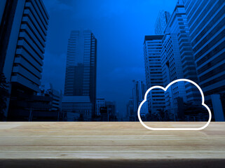 Wall Mural -  Cloud computing icon with copy space on wooden table over modern office city tower and skyscraper, Technology cloud computing concept