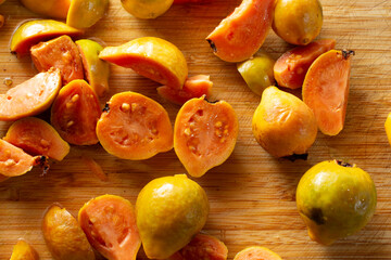 Wall Mural - A top down view of small yellow guavas.