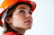 © Fotograf - Woman in a hard hat inspecting the site above her head