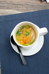 Wall Mural - A top down view of a cup of spaghetti squash soup.