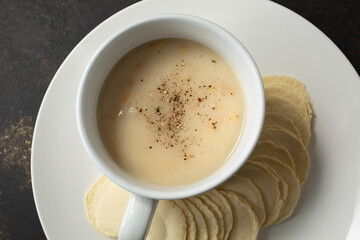 Wall Mural - A top down view of a cup of clam chowder.