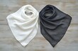© Olya - Elegant black and white twill silk scarf mockup folded on textured wood surface