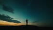 © liliyabatyrova - As twilight envelops the horizon, a solitary figure stands on a rocky outcrop, bathed in divine light from above. Stars twinkle in the vast sky, evoking a sense of wonder and contemplation
