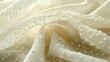 © mlangsen - Elegant, draped, off-white fabric with dotted texture, useful for background image