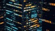 © Matcha_09 - Silhouettes of towering glass office buildings reflecting city lights at night.