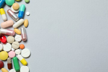 Wall Mural - Various pills on gray background