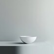 © LeNo - White bowl on minimalist surface, gray background. Product shot for website