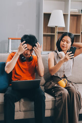 Wall Mural - Smiling couple unpacking boxes in new house