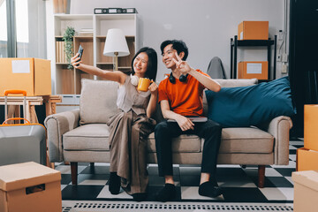 Wall Mural - Smiling couple unpacking boxes in new house