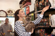 © New Africa - Woman with her cute cat in pet shop