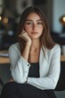 © Alexander LW - A thoughtful girl is waiting for an interview in the office.
