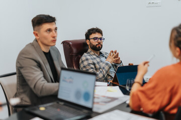 Poster - Group of colleagues brainstorming ideas during a business meeting