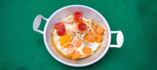 Wall Mural - pan-fried egg with pork and toppings. Breakfast food in Thai style