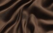 ©  Yassine DS - Luxurious dark brown satin fabric with smooth silky texture and elegant flowing drapes creating a soft and sophisticated fashion and interior design background