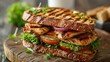 © Pat J. - Grilled chicken sandwich on a wooden table, white background