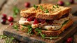 © Pat J. - Turkey and cranberry sandwich on a wooden table, white background