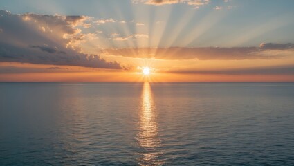 Aufkleber - Sunrise Over Calm Sea Illuminates the Sky with Orange Rays as the Sun Breaks Through Clouds Creating a Serene Seascape.