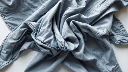 Aufkleber - Crumpled grey cotton napkin on a white surface showcasing texture and fabric detail from a top-down perspective