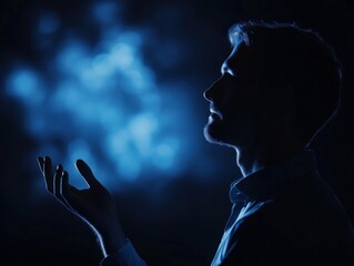 Wall Mural - Silhouette of a man with blue light