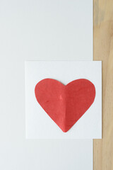 Wall Mural - red heart on blank card, paper, and wood